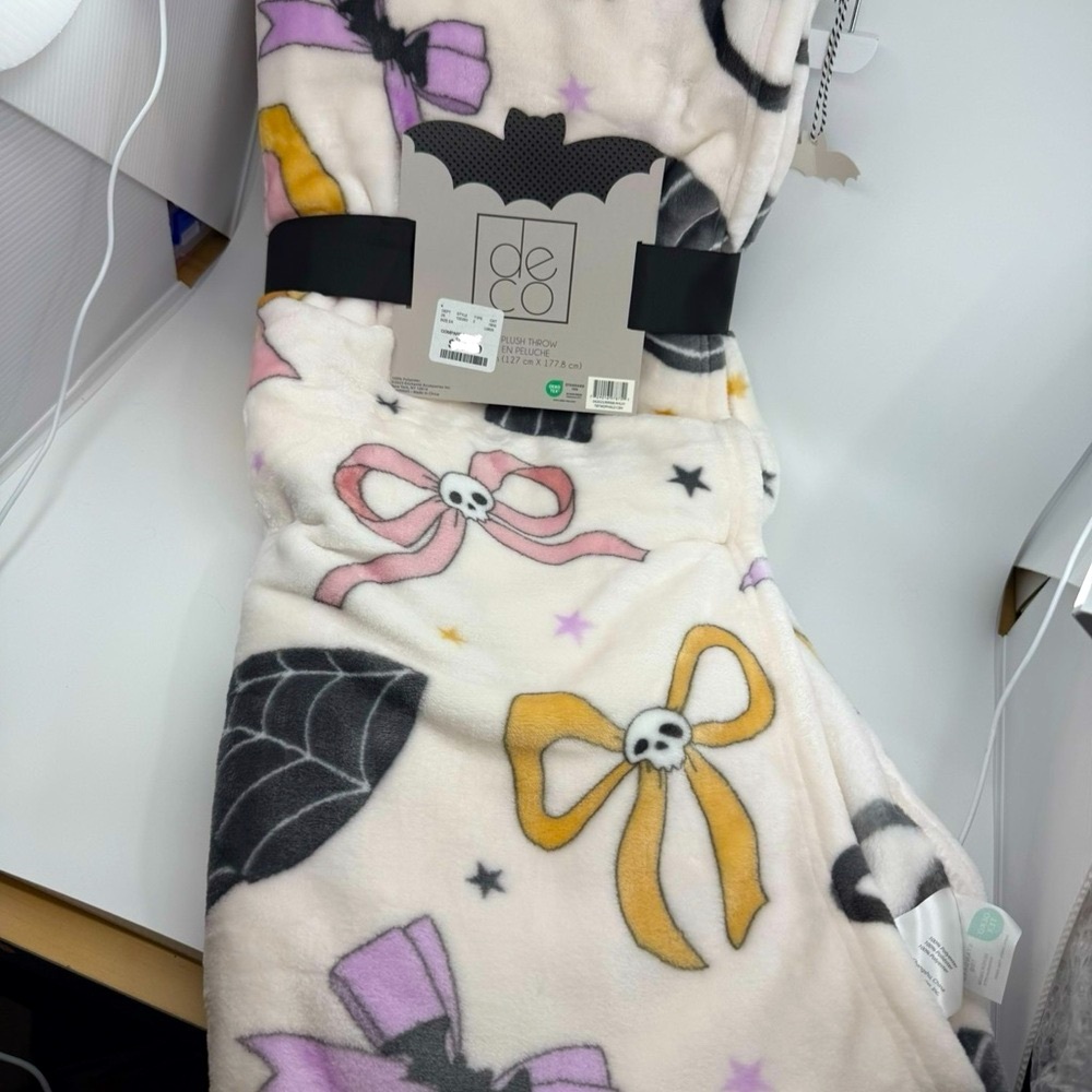 Halloween Themed Blanket with Bows and Skulls, brand new